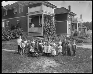 Group of children in rear of Jo. Brown House