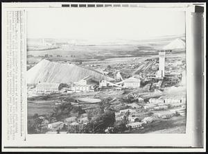 Gold Mine Complex -- This is a view of a modern gold mining complex about 40 miles southwest of Johannesburg, South Africa. South Africa is a modern industrialized nation fast expanding away from almost total economic dependence on gold mining and farming.