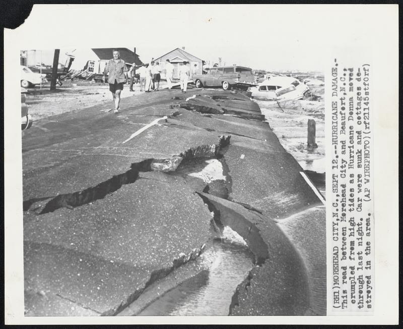 Hurricane Damage.-This read between Morehead City and Beaufort, N.C., crumpled from high tides as Hurricane Donna moved through last night. Car were sunk and cottages destroyed in the area.