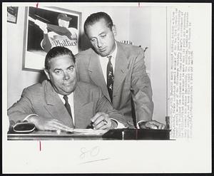 Hamey Named Phillies' General Manager - H. Roy Hamey, seated, former assistant general manager of the New York Yankees and former general manager of the Pittsburgh Pirates, poses with Philadelphia Phillies President Bob Carpenter here today after Hamey's appointment as the Phillies' first general manager in more than six years was announced. Hamey assumed his duties immediately. The position, handled by Carpenter until today, has not been filled since the death of Herb Pennock in January, 1948.