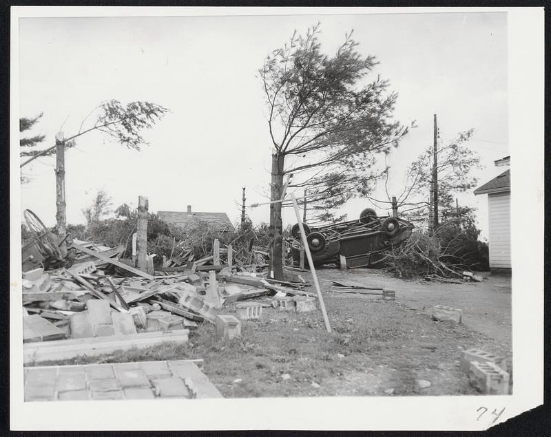 Twister Rips Portsmouth Area. Winds up to 100 miles per hour reduced this Greenland, N.H., barn to wreckage and overturned automobile in background yesterday afternoon. Hundreds of trees also were felled and several roofs torn off.