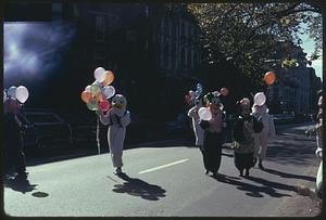 People in mascot costumes walking with balloons, Boston Columbus Day Parade 1973