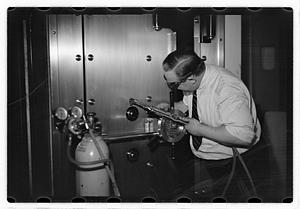 A man demonstrating how to break into a safe