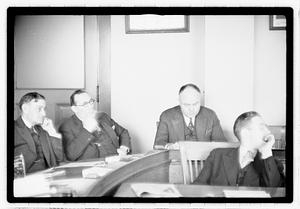 Group of men at table