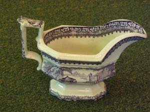 Staffordshire sauceboat with urns and harbors