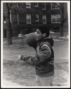 Tico playing with a basketball
