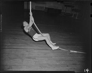 SC gymnast on rope, close to ground