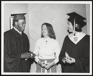 Congratulations go to two leaders of the graduating class of Rindge Technical School from Cambridge Mayor Barbara Ackermann. Clasping their coveted sheepskins are Class President Emerson A. Bascomb and Class Valedictorian Stanley F. Yee. Both have received scholarships, Bascomb from Northeastern University, and Yee from Cornell.