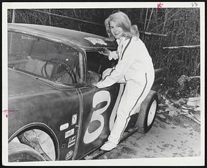 Dottie Climbs into her race car, a ‘56 Ford she bought from John Rosati of Agawam who won many a race with it.