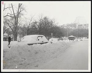 Stranded cars and huge drifts left in wake of worst Eastern U.S. storm in 16 years. It walloped Boston with 60-mile-an-hourwinds. Car is all but buried at Tremont St. Curb near Boston Common.