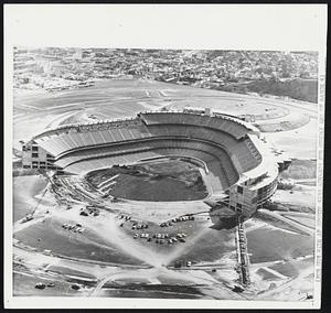 This is Dodger Stadium at Chavez Ravine which is being rushed to completion for the Los Angeles baseball season opening April 10. The 56,000-seat stadium, where the Dodgers and the Angels will play, is expected to cost between $16 million and $18 million. Parking lots on four levels outside the stadium will accommodate 16,000 cars.