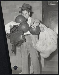 4 - Loaded for Travel is assistant manager Dick Jackson of Washington, D.C., who will be in charge of equipment.