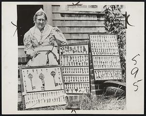 Key Collector. Halifax, Mass.- Miss Nettie F. Thomas with her collection of 300 keys of all shapes and sizes. An unusual hobby. The oldest key dates back to 1706.