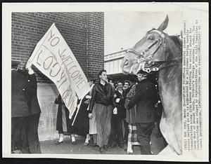 Defiant Picket--A youthful picket (center) stands defiant as he is approached by a policeman during hostile demonstration along 12th avenue protesting the arrival aboard the Queen Mary of Ernest Bevin, Britain's foreign minister, today. The demonstration was staged by representatives of the Joint Committee to Combat Anti-Semitism.