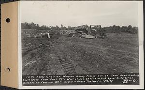 Contract No. 80, High Level Distribution Reservoir, Weston, 12 yd. Athey Crawler Wagon being pulled out of spoil area, looking southwest from a point 75 feet+/- west of Sta. 53+50+/-, high level distribution reservoir, Weston, Mass., Aug. 4, 1939