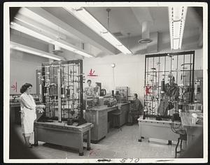 View of Typical Module Typical of some 158 similar units is this research module at Union Carbide's new Parma, Ohio, laboratories, managed by its National Carbon Division. Each module is equipped with the scientific equipment necessary to carry out experiments in the particular field being studied, and is serviced with a wide variety of electrical voltages and gases. Movable metal partitions make it possible to rearrange individual research modules as required.