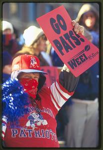 Boston City Hall Plaza (circa 1997) a New England Patriots fan holds up a sign
