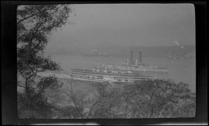 Steamer Washington Irving and battleship with lattice masts on the Hudson River, from Manhattan