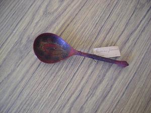 Russian lacquer spoon decorated with stylized flowerheads