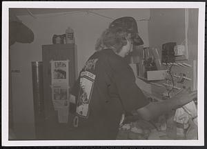 Young man in art class making tie-dye shirts
