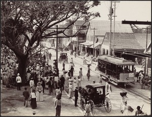 View of busy Jubolee Market in Kingston, Jamaica; horse and buggies in street, streetcar #48 "Halfway Tree & Hope Gardens"