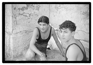 Two unidentified young men playing rock scissor paper