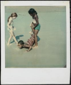 Girls playing at the beach