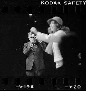 Polaroid's Edwin Land demonstrates Polavision movie camera to shareholders, Cambridge