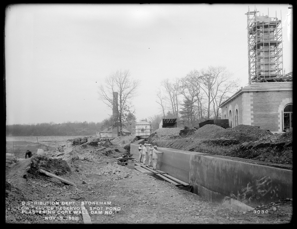 Distribution Department, Low Service Spot Pond Reservoir, plastering core wall, Dam No. 1, from the south, Stoneham, Mass., Nov. 9, 1899