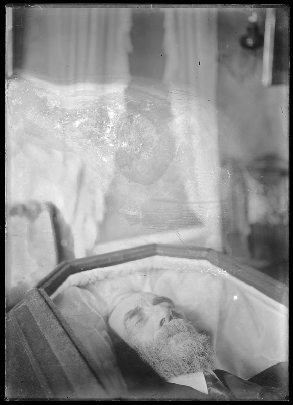 Bearded man in coffin