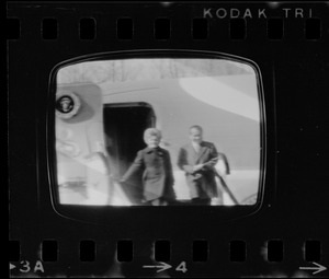 Television showing President Richard Nixon and Pat Nixon arriving in Beijing