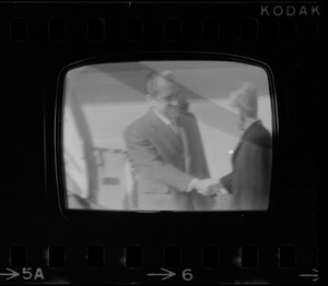 Television showing President Richard Nixon and Pat Nixon arriving in Beijing