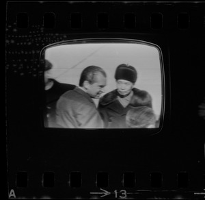 Television showing President Richard Nixon and Pat Nixon arriving in Beijing