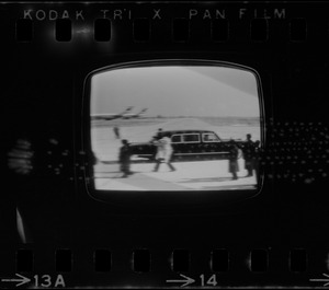 Television showing President Richard Nixon and Pat Nixon arriving in Beijing