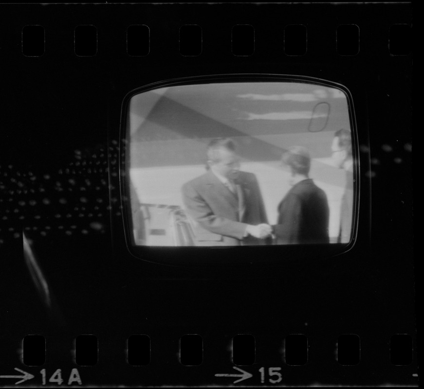 Television showing President Richard Nixon and Pat Nixon arriving in Beijing