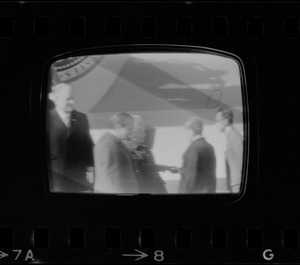 Television showing President Richard Nixon and Pat Nixon arriving in Beijing