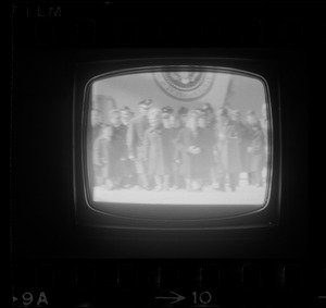 Television showing President Richard Nixon and Pat Nixon arriving in Beijing