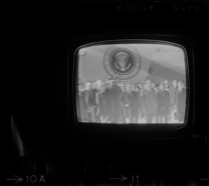 Television showing President Richard Nixon and Pat Nixon arriving in Beijing