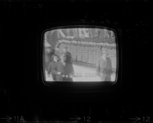 Television showing President Richard Nixon and Pat Nixon arriving in Beijing