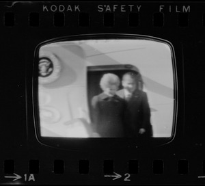 Television showing President Richard Nixon and Pat Nixon arriving in Beijing