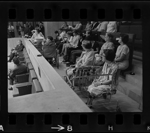 Helene Cummings addresses City Council hearing on the plight of handicapped persons from her stretcher-bed