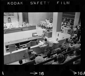 Helene Cummings addresses City Council hearing on the plight of handicapped persons from her stretcher-bed