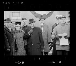 Group of people in front of the Emancipation Memorial, Park Square, Boston, including Governor Volpe, standing next to the speaker