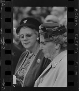 Two women in crowd watching Billy Graham at Boston Garden