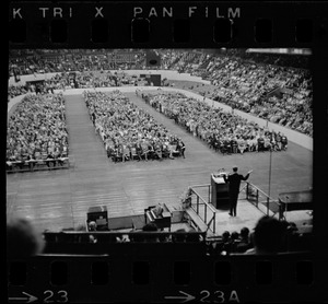 Billy Graham speaking at Boston Garden, crowd in front of him in three sections