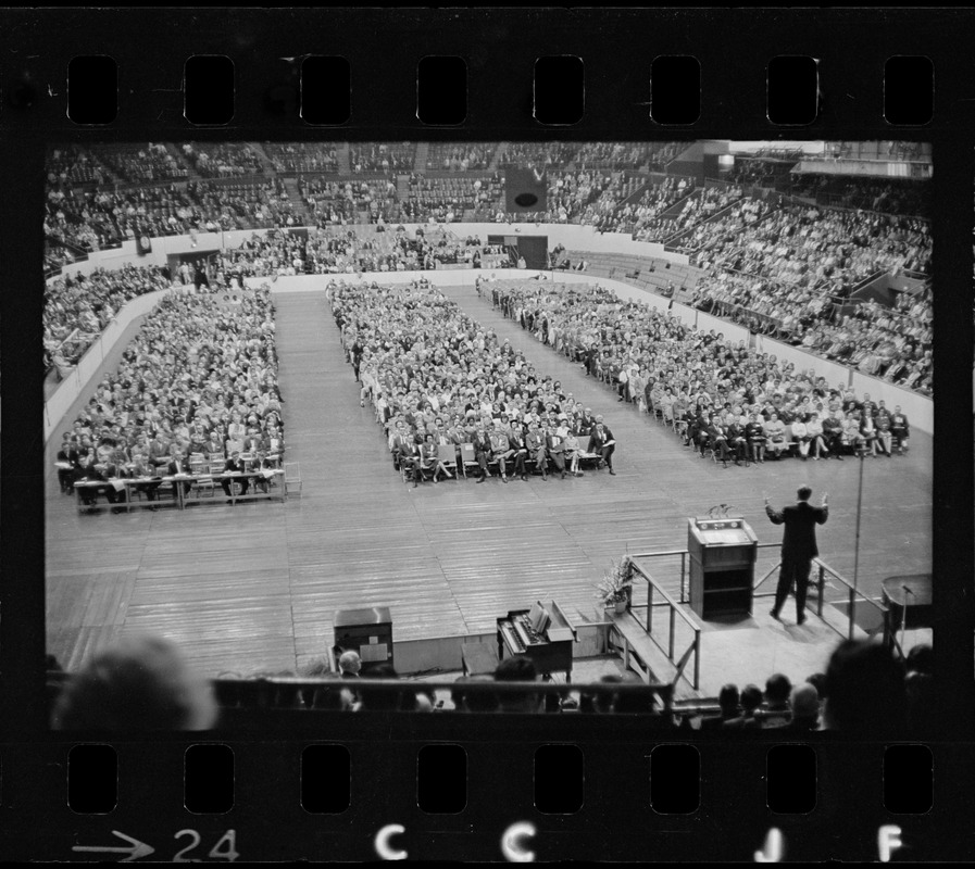 Billy Graham speaking at Boston Garden, crowd in front of him in three sections