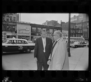 Billy Graham is greeted by Allen C. Emery, Weymouth, executive chairman of Greater Boston Billy Graham Crusade, at Boston's Hotel Statler Hilton