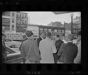 Billy Graham outside of Hotel Statler Hilton in Boston, greeting crowd of people