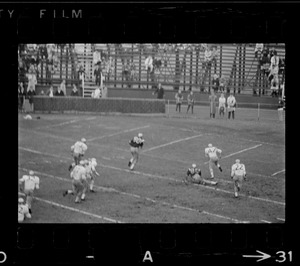 Football game, player running with ball