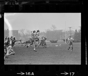 Football player jumping and catching the ball